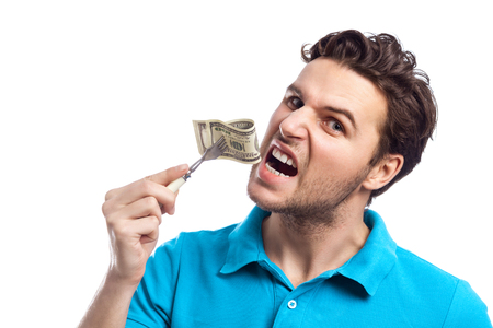 Handsome Man Eating Hundred Dollar Isolated On White Background. Business Themeの写真素材