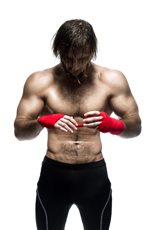 Mixed Martial Arts Fighter Preparing Bandages For Training Isolated On White Backgroundの写真素材