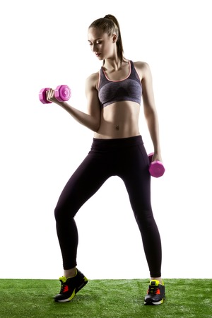 Fitness Woman With Pink Dumbells Isolated On White Backgroundの写真素材