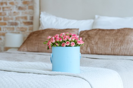 Bouquet Of Pink Roses In A Box On The Bed