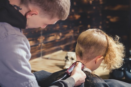 Little Boy Getting Haircut By Barberの写真素材