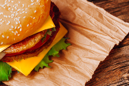 Close-up Homemade Big Burger On Wooden Tableの写真素材