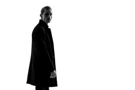 Handsome Fashion Man In Black Coat Posing On White Background. Model Testの写真素材