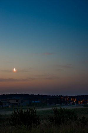 Moonrise before sunriseの写真素材