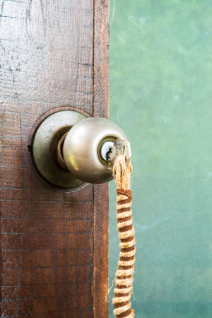 Door keys hanging on the doorの写真素材