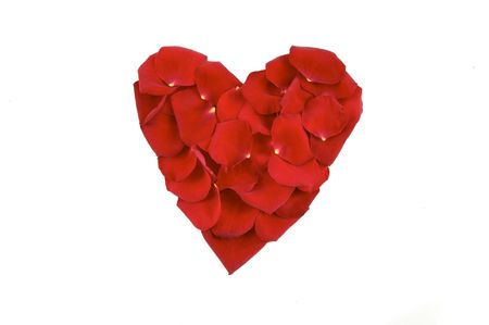 Heart made of red roses petalsの写真素材