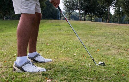 man playing golfの写真素材