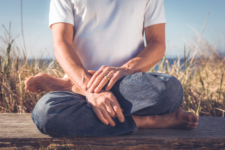 Man sitting in Yoga Pose.の写真素材