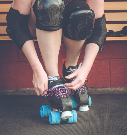 Woman on roller skates outside of a roller rink.の写真素材