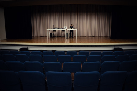 Stage is set to give a talk to an audience. No one is in their seats yet.の写真素材