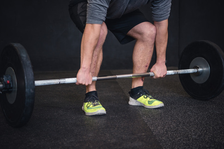 Lifting weights in cross fit gymの写真素材