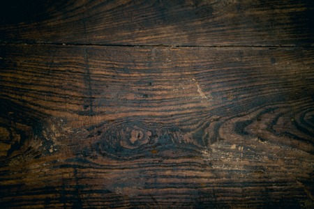 Close up of old, rustic, scratched brown wood surface.の写真素材