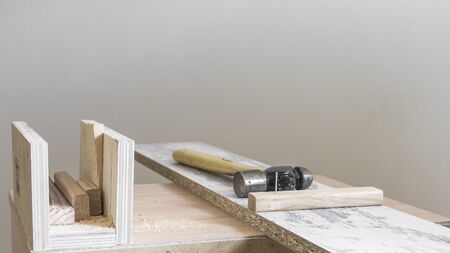 carpenter's work table with hammer and nailの写真素材