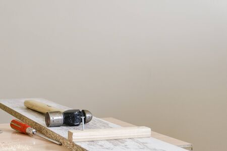 carpenter's work table with hammer and screwの写真素材
