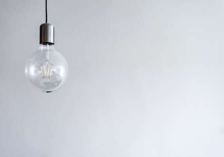 retro big light bulb hanging on white background