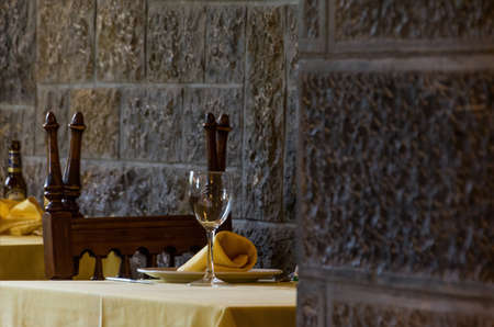 Tables of a restaurant ready to start eatingの写真素材