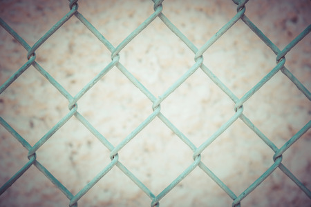 Old iron wire fence, close-up wire mesh fenceの写真素材
