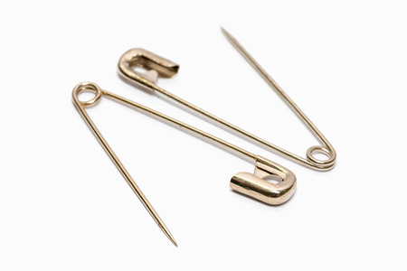 Safety pin isolated on white backgroundの写真素材