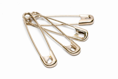 Safety pin isolated on white backgroundの写真素材