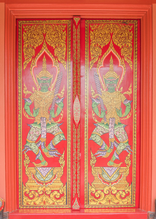 Ancient Gold carving wooden door of Thai templeのeditorial素材