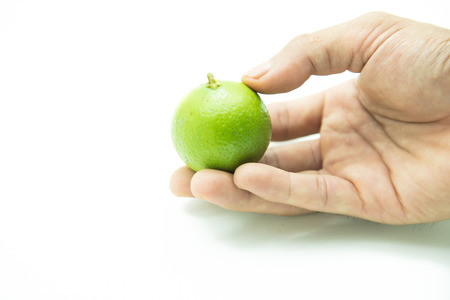 close up of fresh limes on handの写真素材