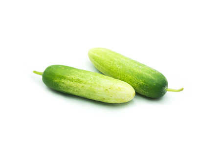 fresh cucumbers isolated on whiteの写真素材