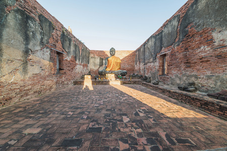 Asian religious architecture. Ancient sandstone sculpture of Buddha at Wat Phra Sri Sanphet temple ruins . Ayutthaya, Thailand travel landscape and destinationsの写真素材