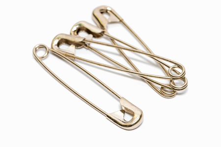 Safety pin isolated on white backgroundの写真素材