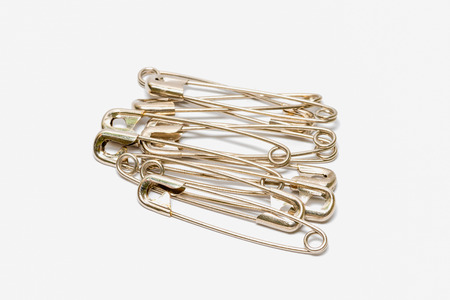Safety pin isolated on white backgroundの写真素材