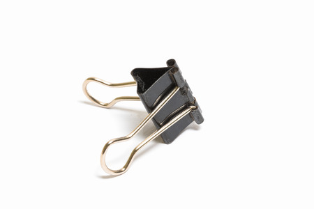Black Paper clip isolated on white background.の写真素材