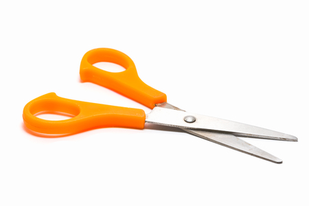 Yellow scissors isolated on a white backgroundの写真素材