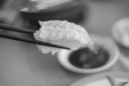 sushi with chopsticks, black and whiteの写真素材