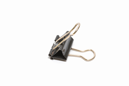 Black Paper clip isolated on white background.の写真素材
