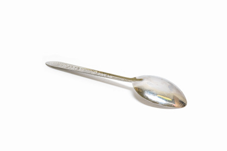 old silver spoon isolated on white with clipping pathの写真素材