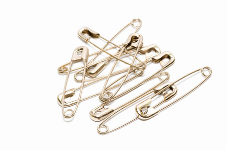 Safety pin isolated on white backgroundの写真素材