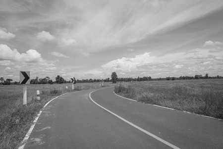 Asphalt road and blue sky , black and whiteの写真素材