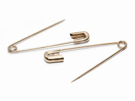 Safety pin isolated on white backgroundの写真素材