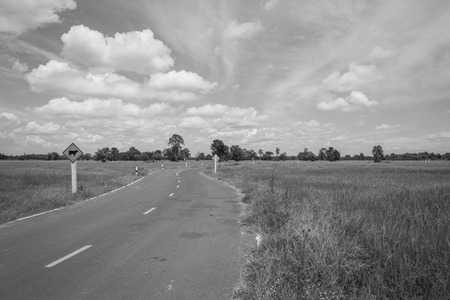Asphalt road and blue sky , black and whiteの写真素材