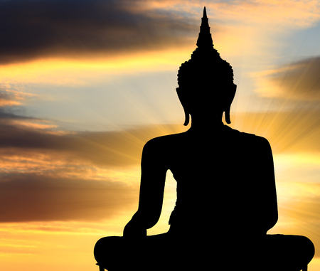 Silhouette Buddha statue with sunset background, Bangkok Thailandの写真素材