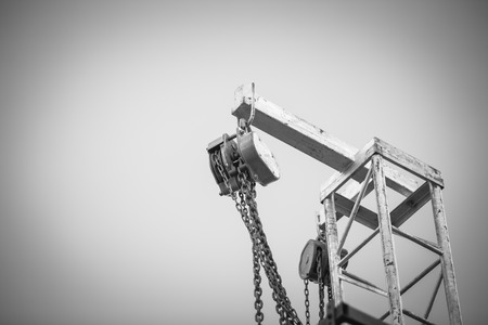 iron pulley on blue sky , black and whiteの写真素材