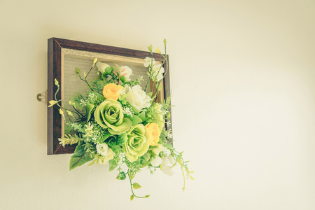 Fake flowers with white wall ,vintageの写真素材
