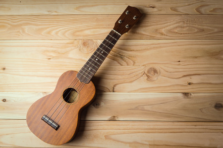 Close up of ukulele on old wooden backgroundの写真素材