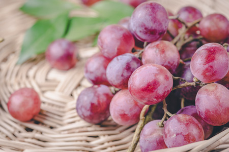 purple round grapes on  wicker baskets , vintageの写真素材