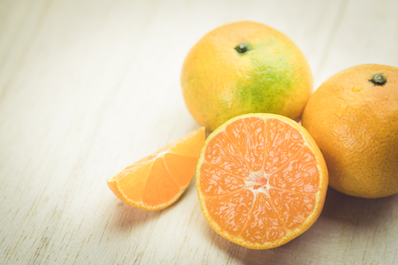 Oranges isolated cut set on wooden base , vintageの写真素材