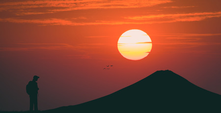 Tourists look the volcano fuji on sunset , silhouette , vintageの写真素材