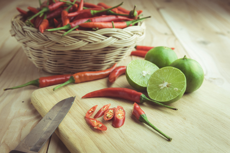 Sliced red chili pepper on a cutting board , vintage toneの写真素材