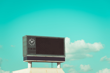 score board at football stadium with bluesky , vintage toneの写真素材