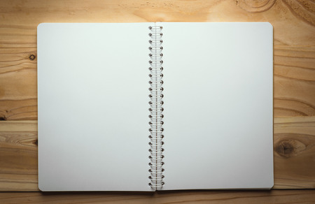 note paper on wood texture background with copy spaceの写真素材