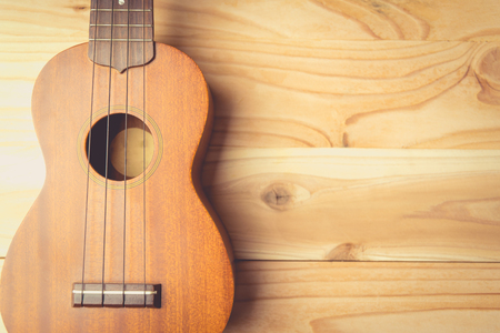 Close up of ukulele on old wooden backgroundの写真素材