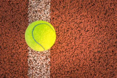 Close up of tennis ball on clay court./Tennis ballの写真素材